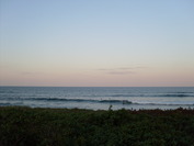 Lennox Head point surfers at sunset